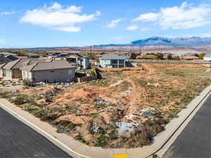 Aerial perspective of suburban area featuring a mountain backdrop