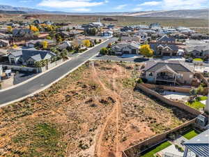 Aerial perspective of suburban area with a mountain backdrop