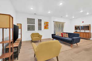 Living room with hard flooring and recessed lighting