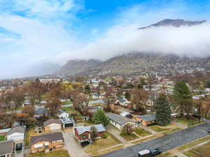 Aerial view of residential area featuring a mountainous background