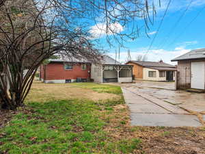 View of front of home featuring brick siding and a front yard