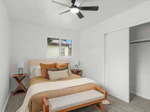 Bedroom featuring carpet, a closet, and a ceiling fan