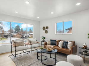 Living area with recessed lighting and wood finished floors