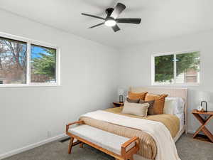 Bedroom with carpet flooring and ceiling fan