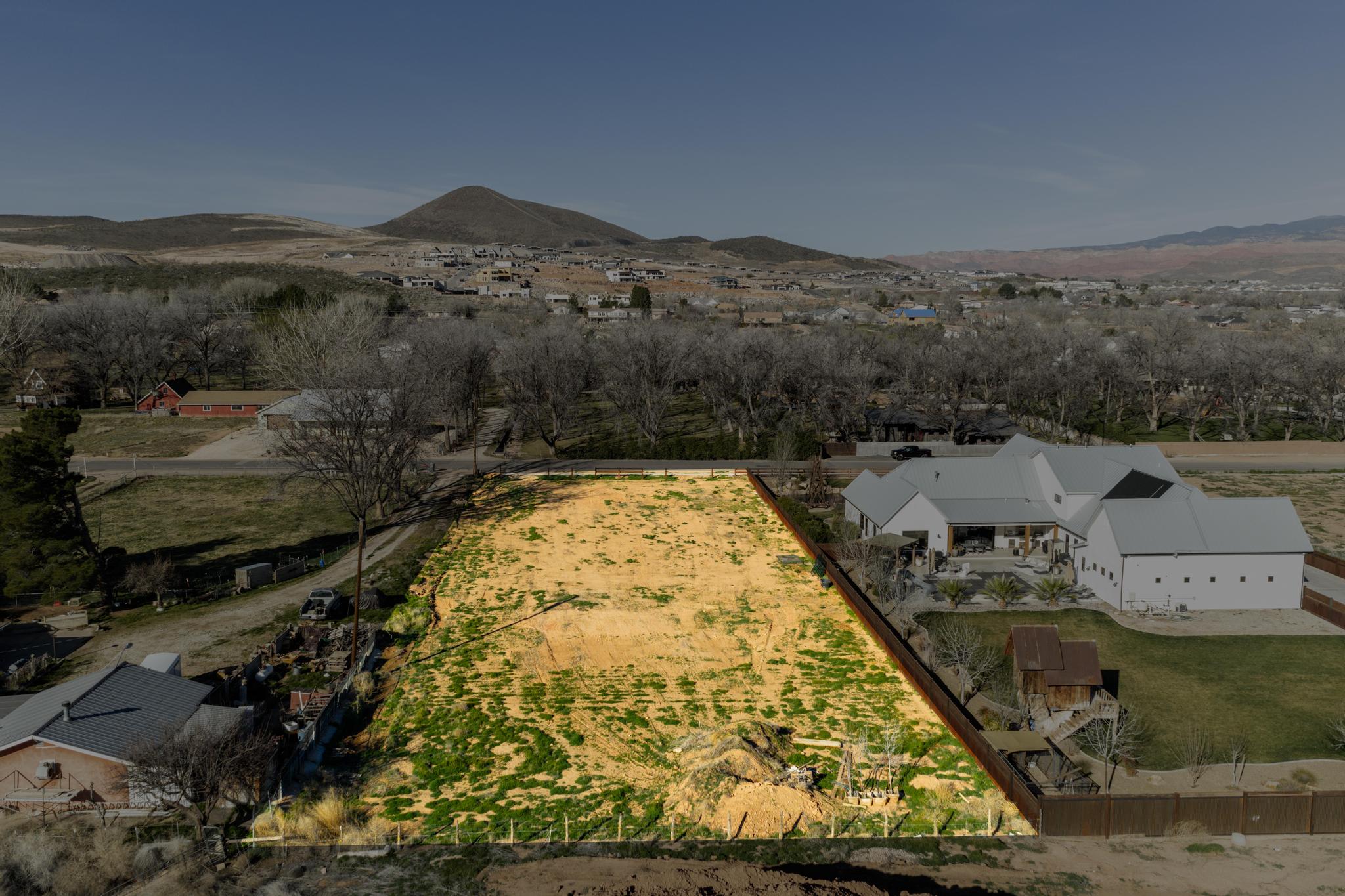 Overview of rural landscape featuring a mountain backdrop
