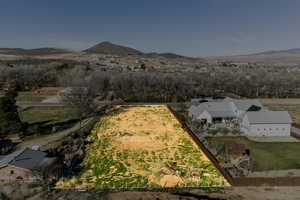 Overview of rural landscape featuring a mountain backdrop