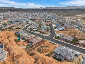 View of property location featuring mountains and nearby suburban area