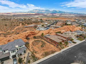 Aerial view of residential area featuring a mountainous background