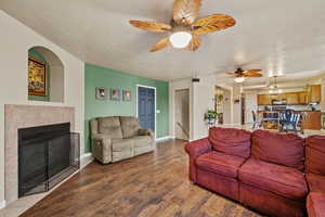 Another angle of the family room highlighting the fireplace and comfortable seating area.