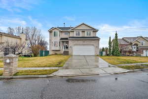 Traditional-style beautiful two-story home with great curb appeal in a quiet Roy neighborhood.