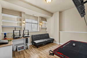 Spacious bedroom with closet and flexible space for sleeping, study, or hobbies.