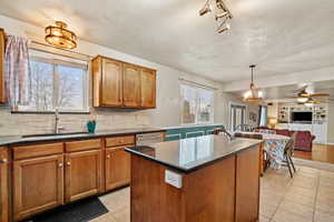Bright kitchen with large window over the sink and plenty of counter space for cooking and entertaining.
