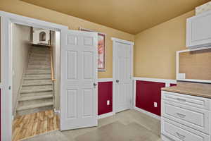 Functional workspace with built-in cabinetry and storage.