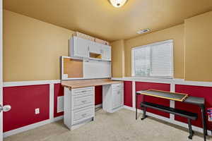 Versatile room perfect for a home office, craft room, or study space.