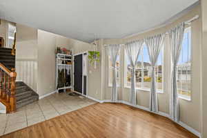 Spacious front living area with beautiful windows and plenty of natural light.