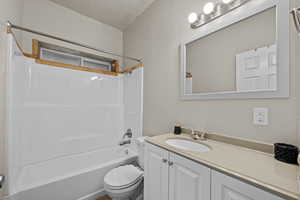 Additional full bathroom with vanity and tub/shower combination.