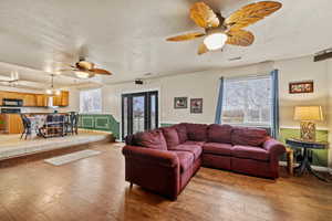 Open living space connecting the family room, dining area, and kitchen.