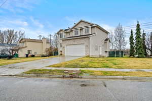 Large driveway and attached 2-car garage with plenty of parking space.