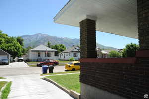 View of grassy yard featuring a mountain view and a residential view