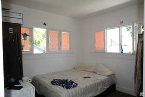 Bedroom featuring multiple windows