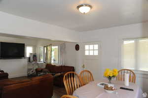 Dining space with wood finished floors and baseboards