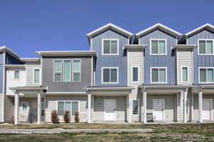 View of front facade featuring a porch and board and batten siding
