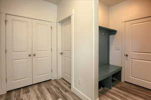 Mudroom with dark wood-style floors