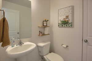 Half bath featuring toilet