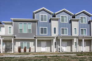 View of front of home featuring board and batten siding and covered porch