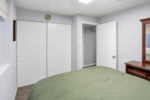 Bedroom featuring carpet floors and a closet
