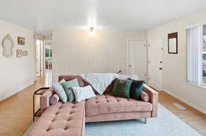 Living room with wood finished floors and baseboards