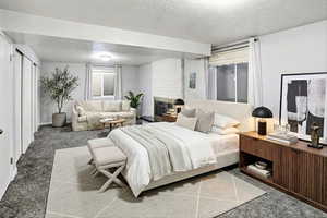 Staged as primary bedroom ensuite in basement. This room has a fireplace and could also be used as a living room.