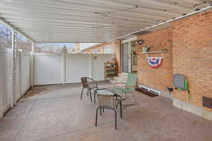 View of fenced patio / terrace with a gate
