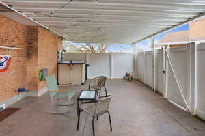 View of fenced patio / terrace with a gate