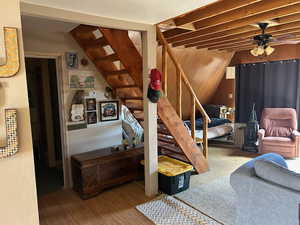 Bedroom featuring wooden walls and light wood-type flooring