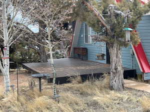 View of property exterior featuring a deck