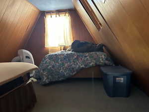 Bedroom with wood walls