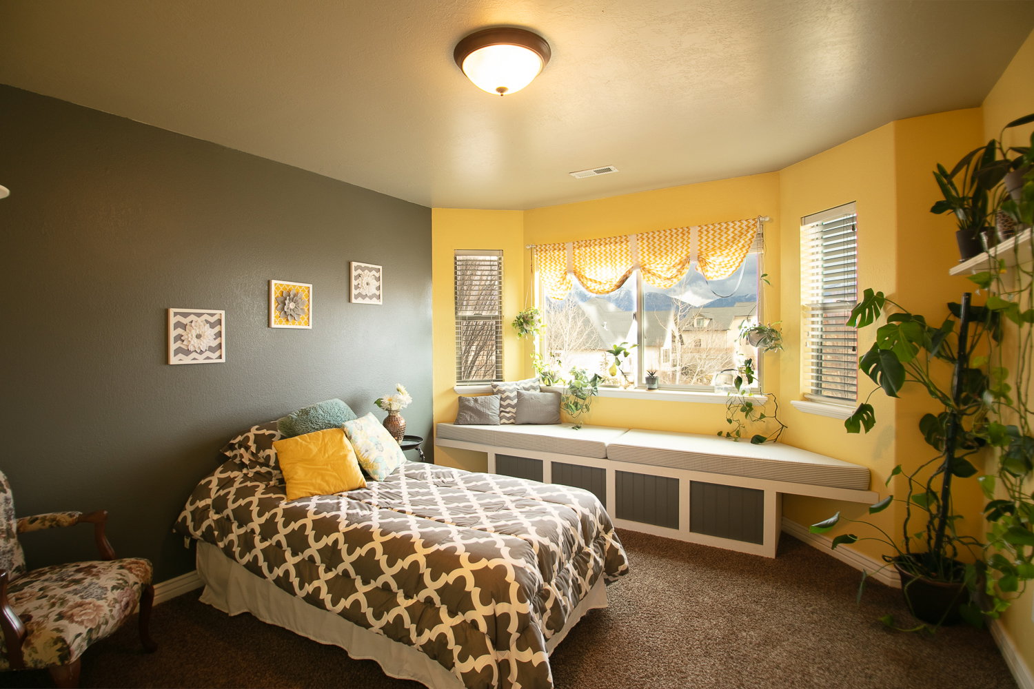 upstairs bedroom featuring a window seat with storage.