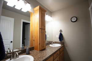 Upstairs full bath with double vanity.