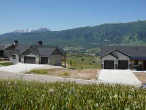 View of mountain background featuring rural landscape