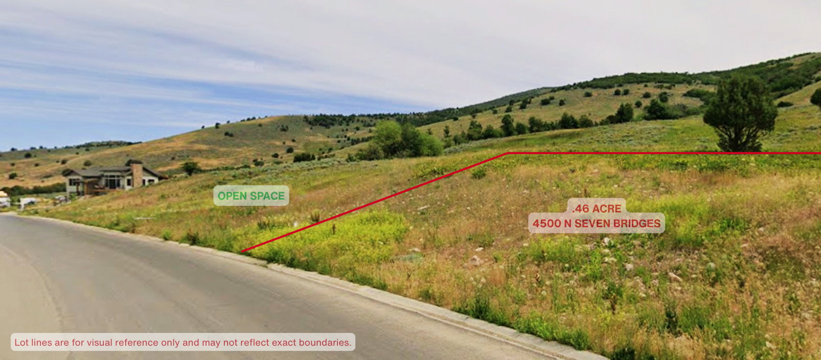 Aerial view of sparsely populated area featuring property parcel outlined