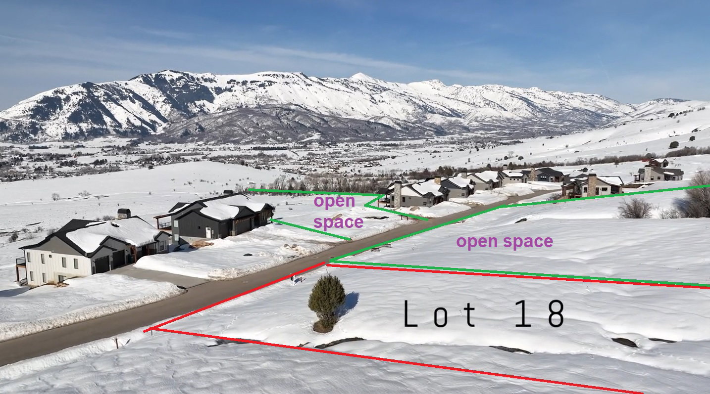 Snowy aerial view with a residential view and a mountain view