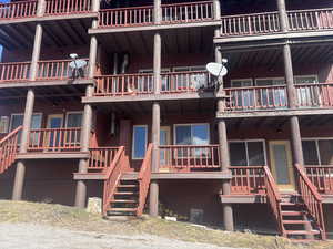 View of apartment building / complex with stairway