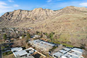Aerial view of residential area featuring a mountainous background