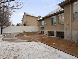 Back of house featuring stucco siding and a patio area