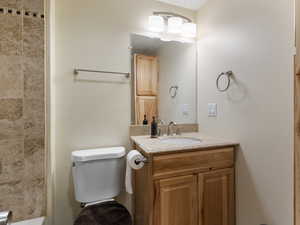 Full bath with vanity and toilet