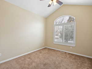 Unfurnished room with ceiling fan and carpet floors