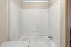 Full bathroom with bathtub / shower combination