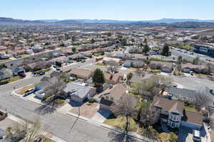 Aerial view of residential area featuring a mountain backdrop