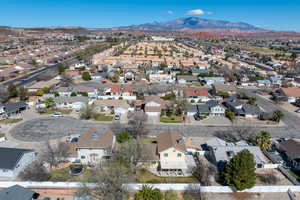Aerial view of residential area featuring a mountain backdrop